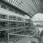 View of a multi-storey shopping mall with people strolling around